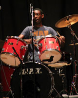 A picture of Darius Faison playing drums
